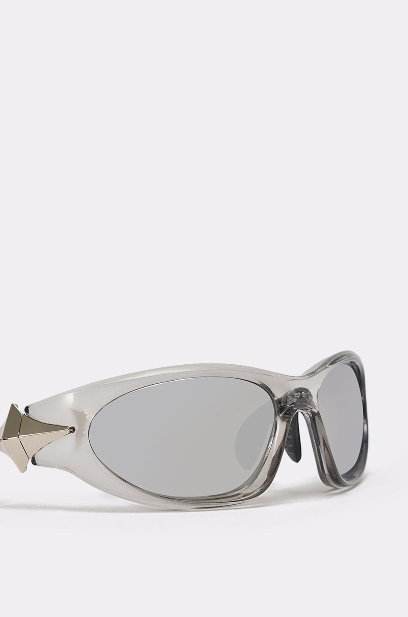 The STARSTRUCK SUNGLASSES feature a lightweight plastic frame, gray-tinted lenses, and silver geometric temple accents, showcased against a plain white background. 4