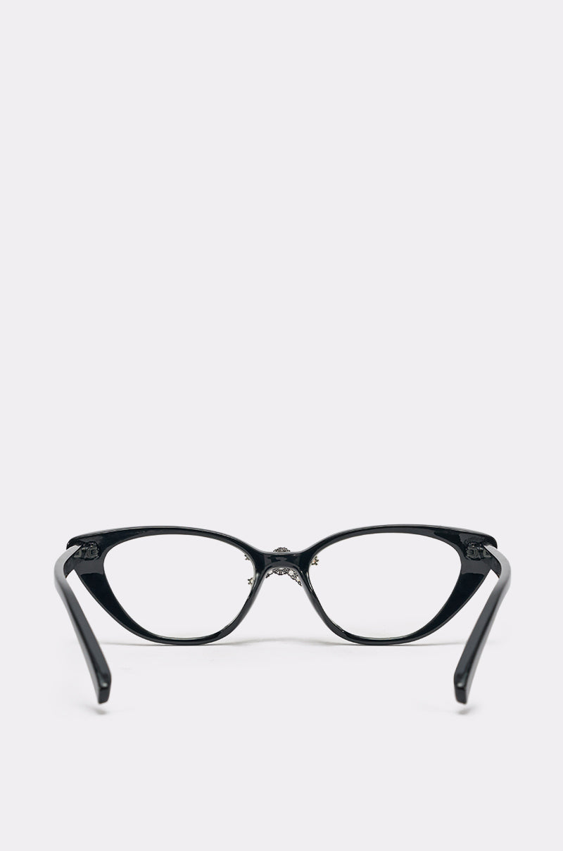 FEMME GLASSES: Black cat-eye eyeglasses with a bold black frame and clear lenses, displayed front-facing on a white background. The arms are angled slightly outward. 3