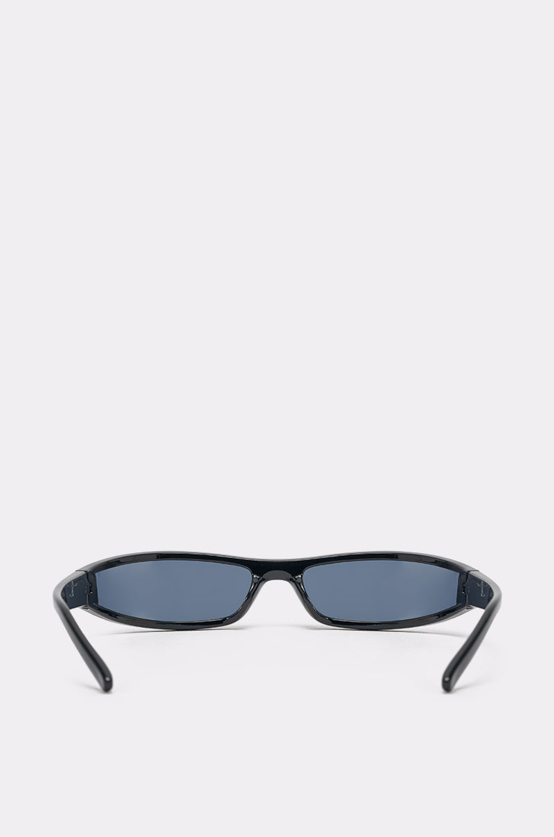 The IN THE FUTURE SUNGLASSES are black, narrow rectangular sporty shades with dark lenses and a sculpted black frame, displayed from the front on a plain light gray background. 3