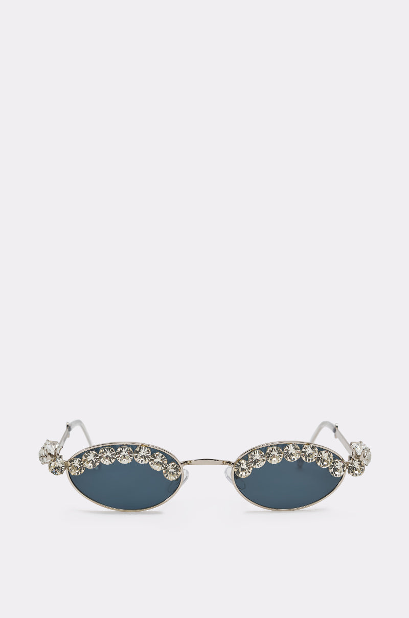CRY DIAMONDS SUNGLASSES feature retro oval dark lenses, sparkling rhinestones on the rims and temples, and a shiny metallic frame, shown against a plain white background. 1