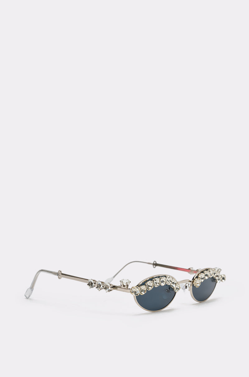 CRY DIAMONDS SUNGLASSES: Retro oval sunglasses with dark lenses, gold frames, and a row of sparkling crystal rhinestones and embellishments along the top edge. 2