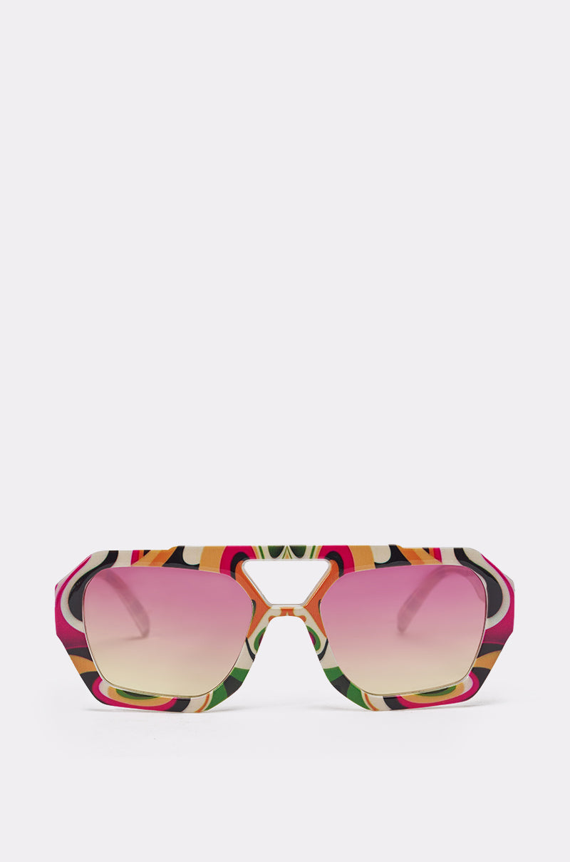 The FEEL THE BEAT SUNGLASSES feature bold, geometric oversized rectangular frames and gradient pink lenses, making a vibrant statement. Shown against a plain white background. 1