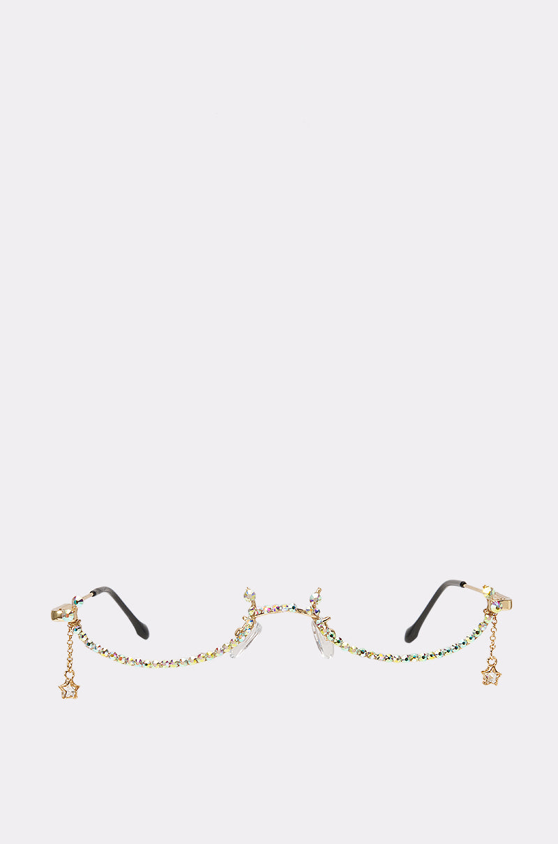 GILDED CHARM FRAMES—gold eyeglasses chains adorned with colorful beads and small star charms at each end—make an eye-catching accessory for fans of rhinestone glasses or distinctive rave styles, shown here against a plain white background.