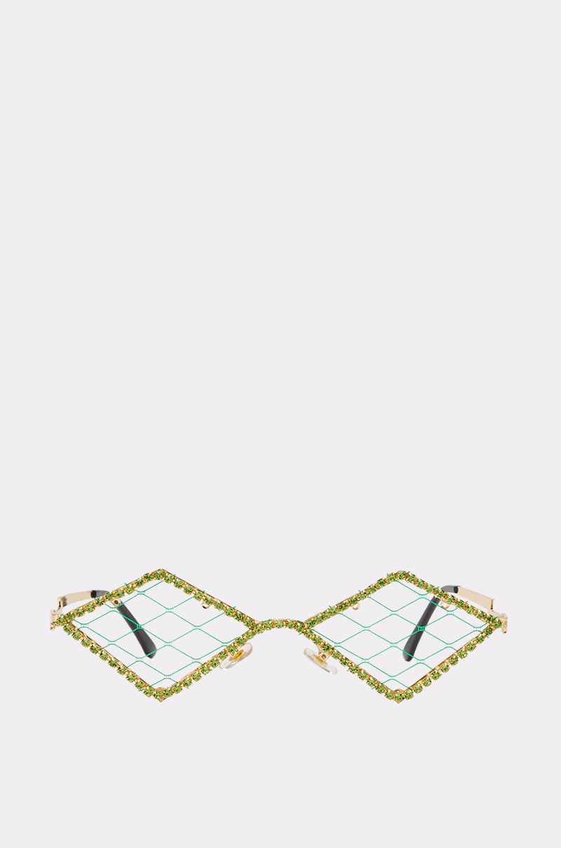 Introducing the TOXIC ENERGY SUNGLASSES: a bold pair of square green statement shades with jeweled rims and clear lenses showcasing an eye-catching green grid pattern. Displayed on a white surface with temples open, these sunglasses are the ultimate festival accessory for making a lasting impression in any crowd.