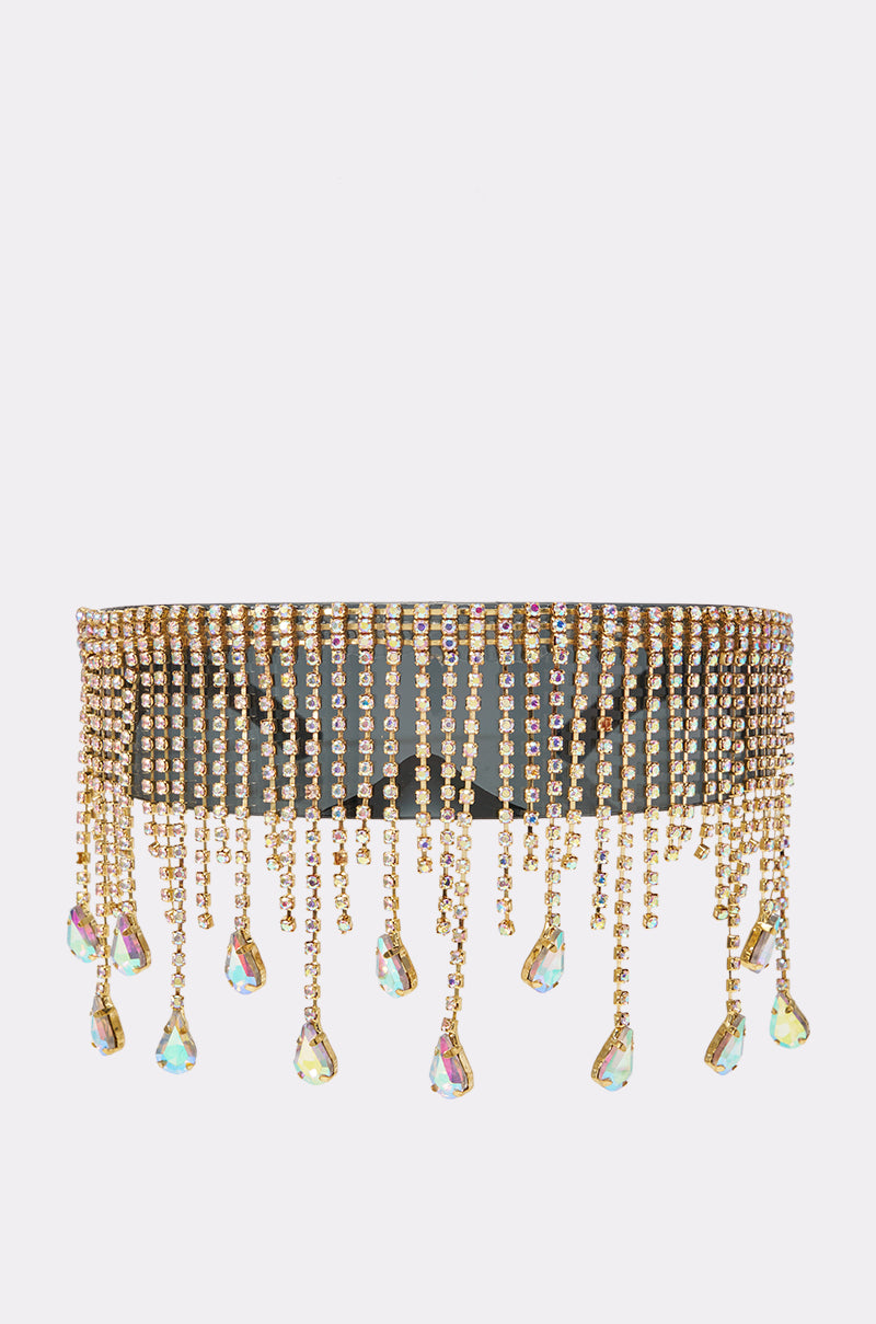 Adorn yourself in radiant style with a gold choker necklace featuring rows of rhinestones and dangling crystal teardrop beads, creating an eye-catching fringe effect that pairs perfectly with bold accessories such as the GOLDEN HOUR DRIP SUNGLASSES.