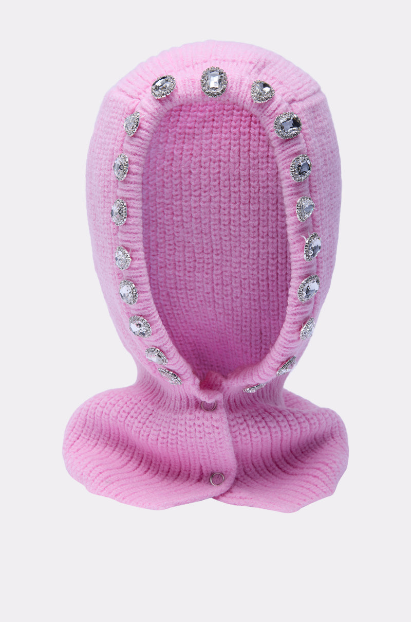 The I REALLY DO THIS EMBELLISHED SNOOD is a pink fisherman knit balaclava with a wide face opening, featuring large clear rhinestones around the edge for a sparkling, cozy look. 2