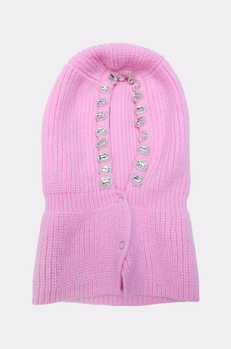 The I REALLY DO THIS EMBELLISHED SNOOD is a pink fisherman knit balaclava with a vertical opening, featuring sparkling rhinestone jewels along the edge for a bold, embellished look. 4