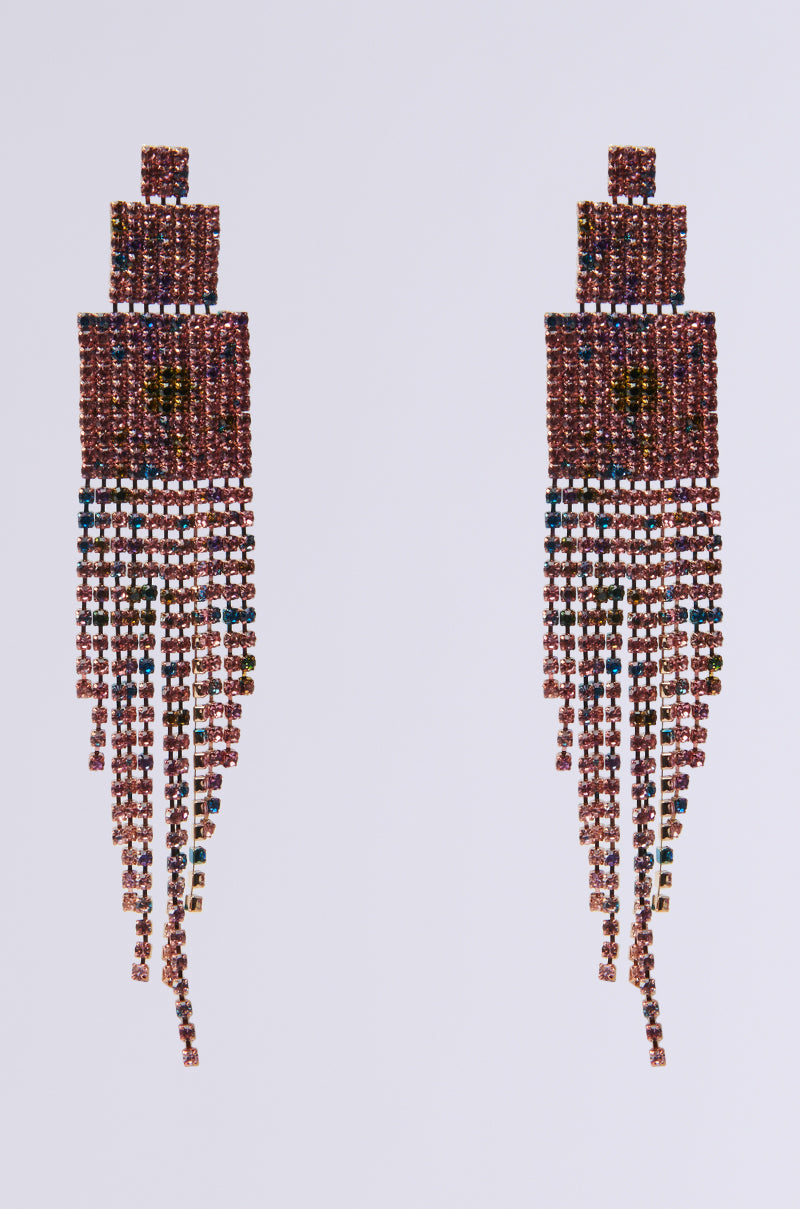 Introducing the RAINBOW DREAMING DANGLE EARRINGS: these elongated rectangular earrings boast cascading strands crafted from small square beads, embellished with multicolored rhinestones. Enhance your style effortlessly with their vibrant hues against a plain background.