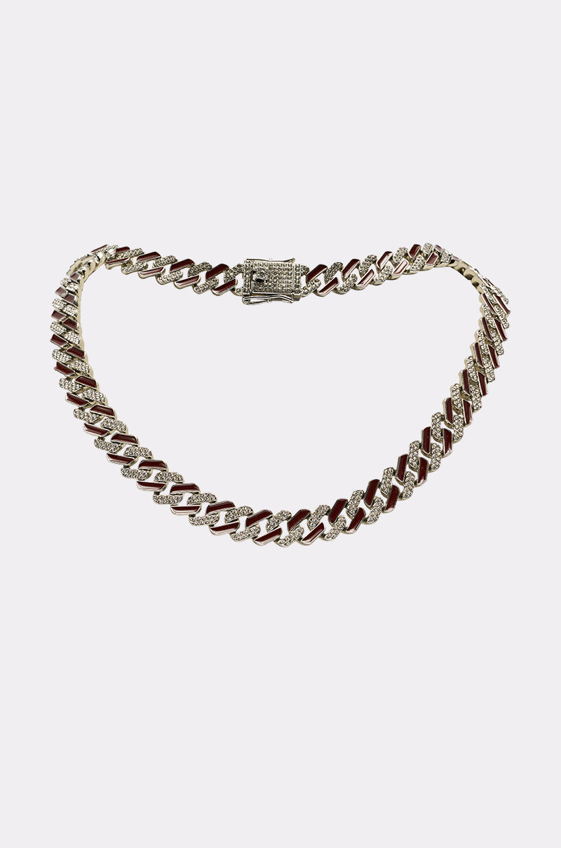 The CANDY CANE NECKLACE is a gold and silver Cuban link statement necklace with a diamond-encrusted clasp, shown on a plain white background. 0