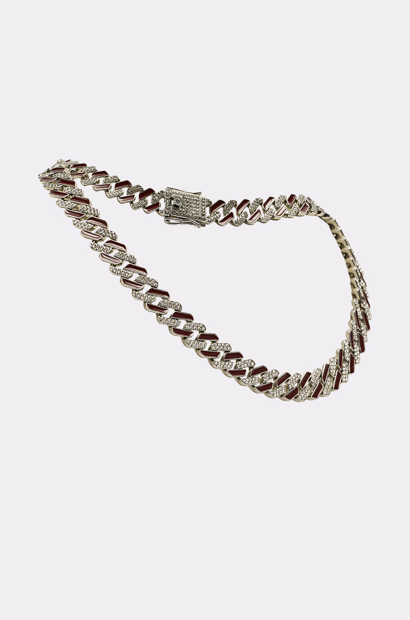 The CANDY CANE NECKLACE, a gold and silver Cuban link chain with a diamond-encrusted clasp, is showcased against a plain white background. 2