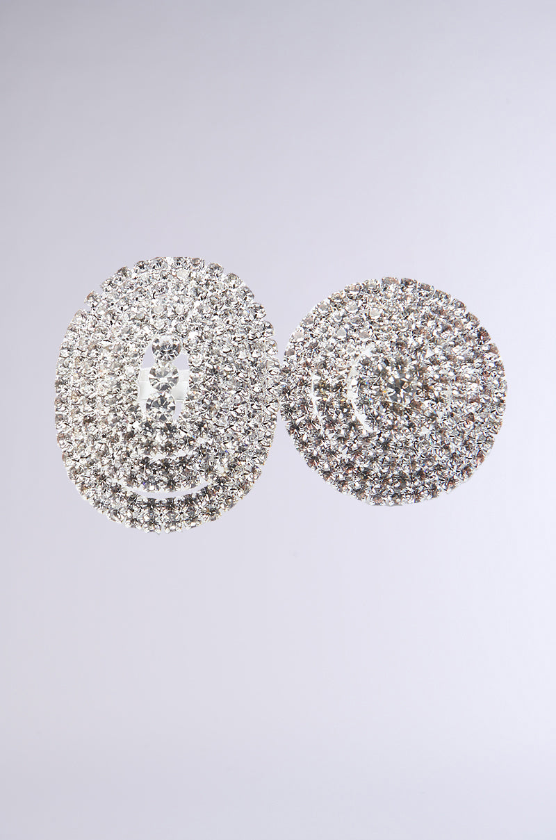 Explore the IN PARIS BLING RING SET, showcasing silver circular earrings adorned with concentric layers of sparkling rhinestones set against a simple backdrop.