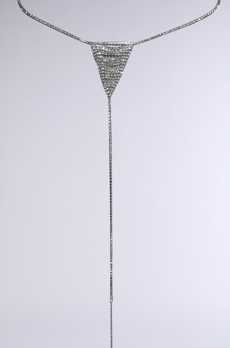 The OOPS MY THONG CHAIN BELT is a silver body chain with a triangular, chainmail-like top adorned with rhinestone links for added sparkle. It features a long, thin chain that enhances any outfit as a thong chain belt, all showcased on a plain white background.