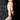 A hand with long, manicured nails rests on black fabric, showcasing the YOU COULD NEVER BRACELET—a sculptural piece that wraps around the wrist and thumb for a bold statement look.