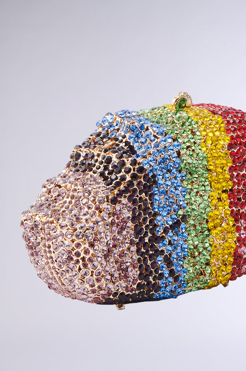 The LICK IT BLING BAG features a beaded animal head design, adorned with sparkling multicolored rhinestones in blue, green, yellow, red, and brown patterns on a plain light gray background.