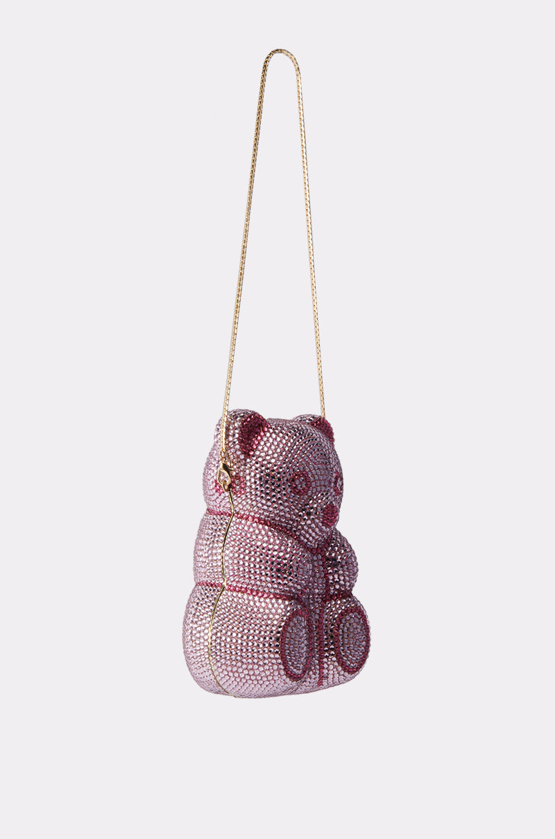 The YUMMY GUMMY BLING BAG is a teddy bear-shaped purse adorned with pink and red crystals and features a gold chainlink strap, displayed on a plain white background.