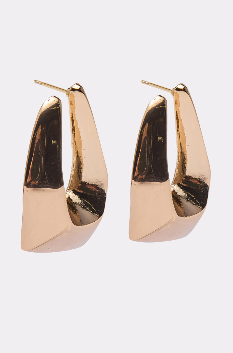The ORIGINAL EARRING features chunky, angular geometric hoops with a modern gold-toned finish, showcased against a plain white background. 2