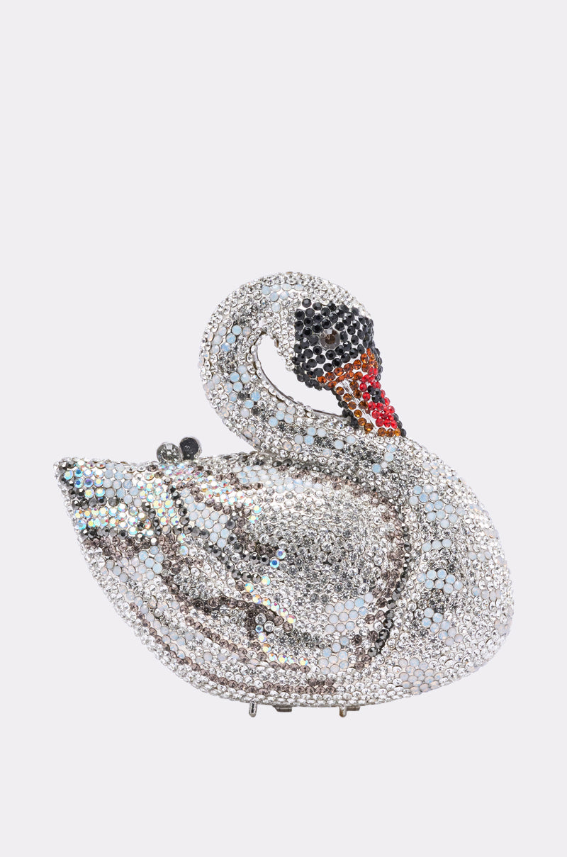 The REGAL BLING CLUTCH, a swan-shaped handbag adorned with silver, black, red, and orange rhinestones and beaded details on its curved neck, shines elegantly against a plain white background. 1
