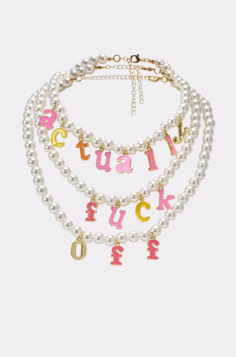 The I SAID WHAT I SAID NECKLACE is a layered streetwear accessory with pink and gold enamel letter charms, adding a playful touch to any outfit. 0