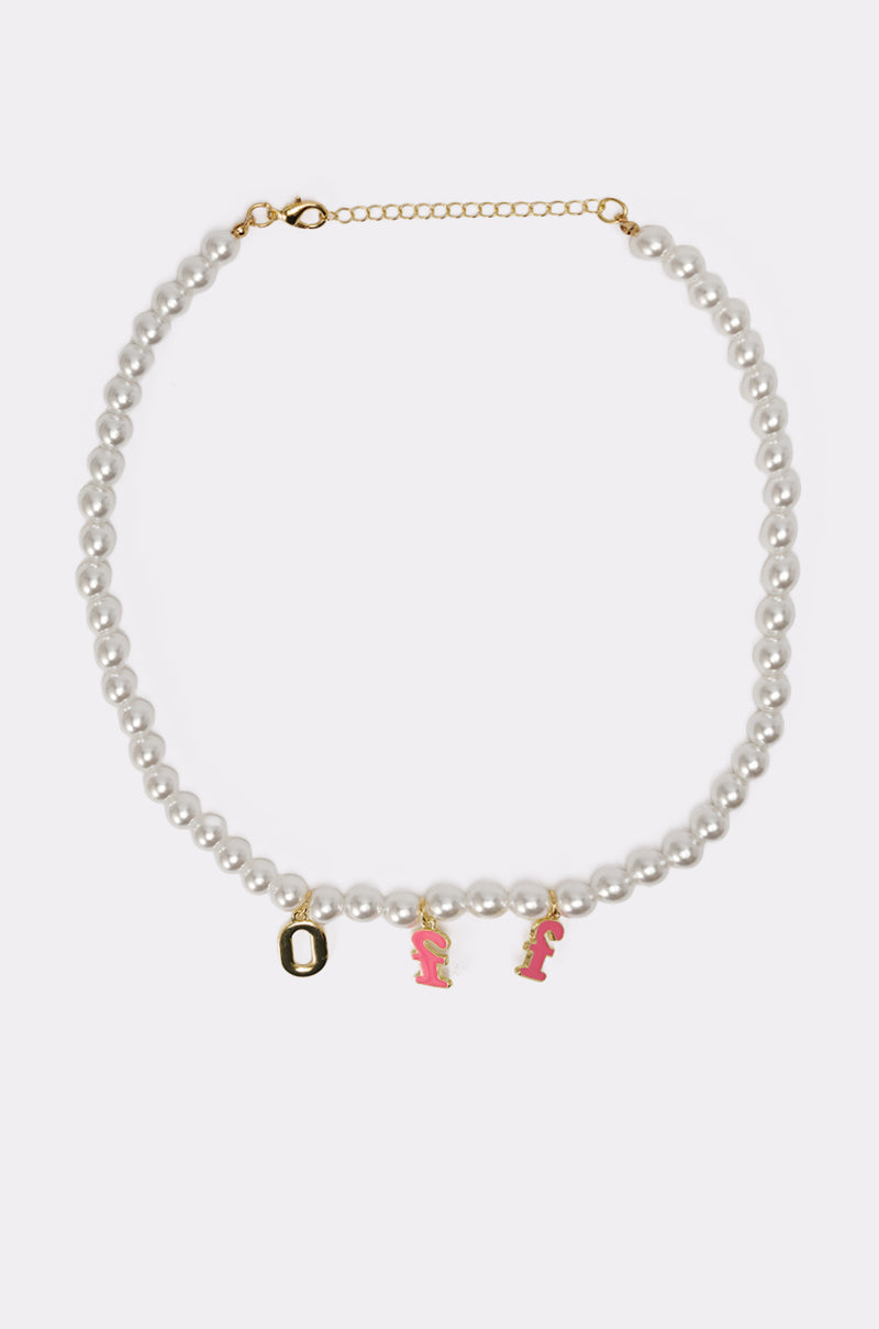 The I SAID WHAT I SAID NECKLACE features faux pearls and three front gold charms: a gold “O” and two pink enamel “F” letter charms. 5