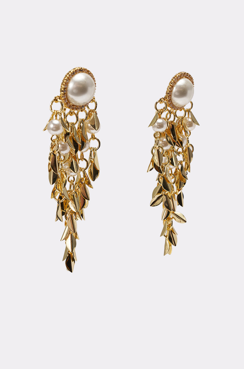 The PARADISE EARRING features gold leaf and pearl studs with cascading charms and dangling pearls, creating statement earrings that redefine classic pearl drops. Photographed on a plain white background for a striking look. 3