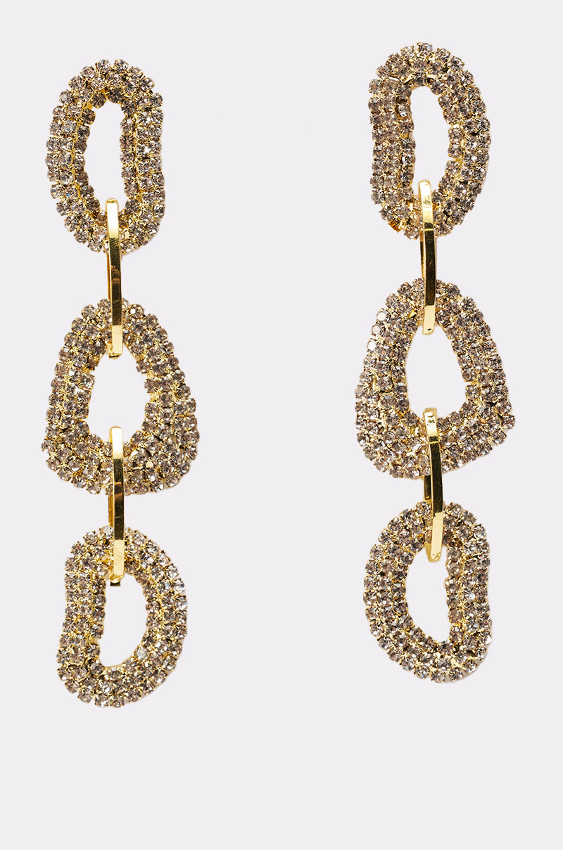 The WILD ONE EARRING features three textured, sparkling oval and triangular gold-tone loops linked by smooth gold connectors, shown against a plain white background. 1