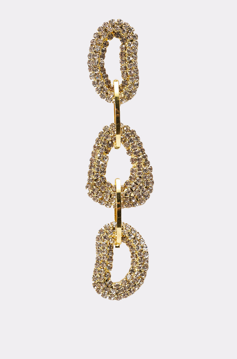 The WILD ONE EARRING showcases three large, irregular oval links encrusted with sparkling rhinestones and connected by smooth gold rings, all in a chic gold-tone finish. 5