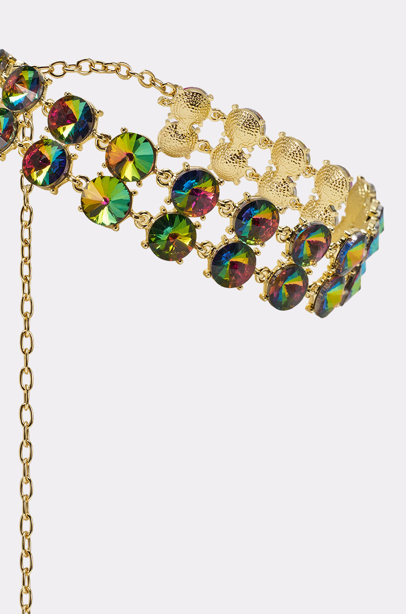 A close-up of the "U HAVENT SEEN THIS BEFORE NECKLACE," a gold choker with round, iridescent multicolored gemstones and intricate detailing, displayed on a plain white background. 3