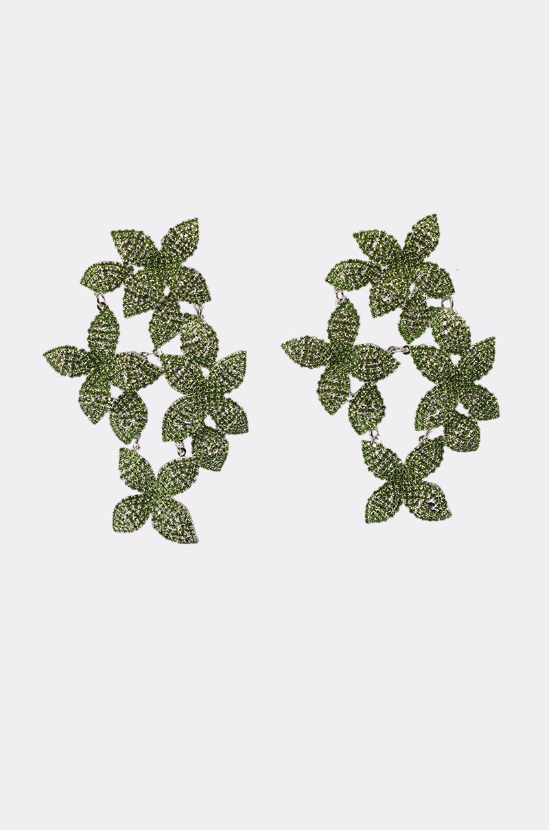 The IN MY GARDEN EARRING features green, leaf-shaped clusters adorned with sparkling stones in a cascading, organic design—eye-catching statement earrings displayed on a plain white background. 1