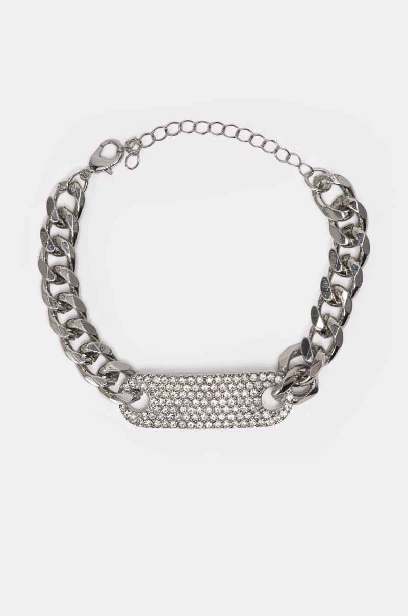 The LETS LINK BRACELET is a chunky silver-tone curb chain with a crystal-encrusted rectangular plate and an adjustable clasp for the perfect fit. 0