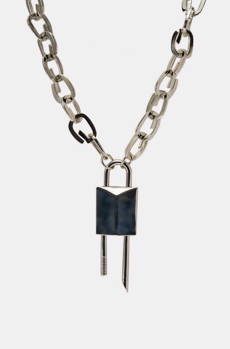 The LOCK IT UP NECKLACE features large oval silver-tone links and a statement lock pendant with two metal bars, shown against a white background. 2