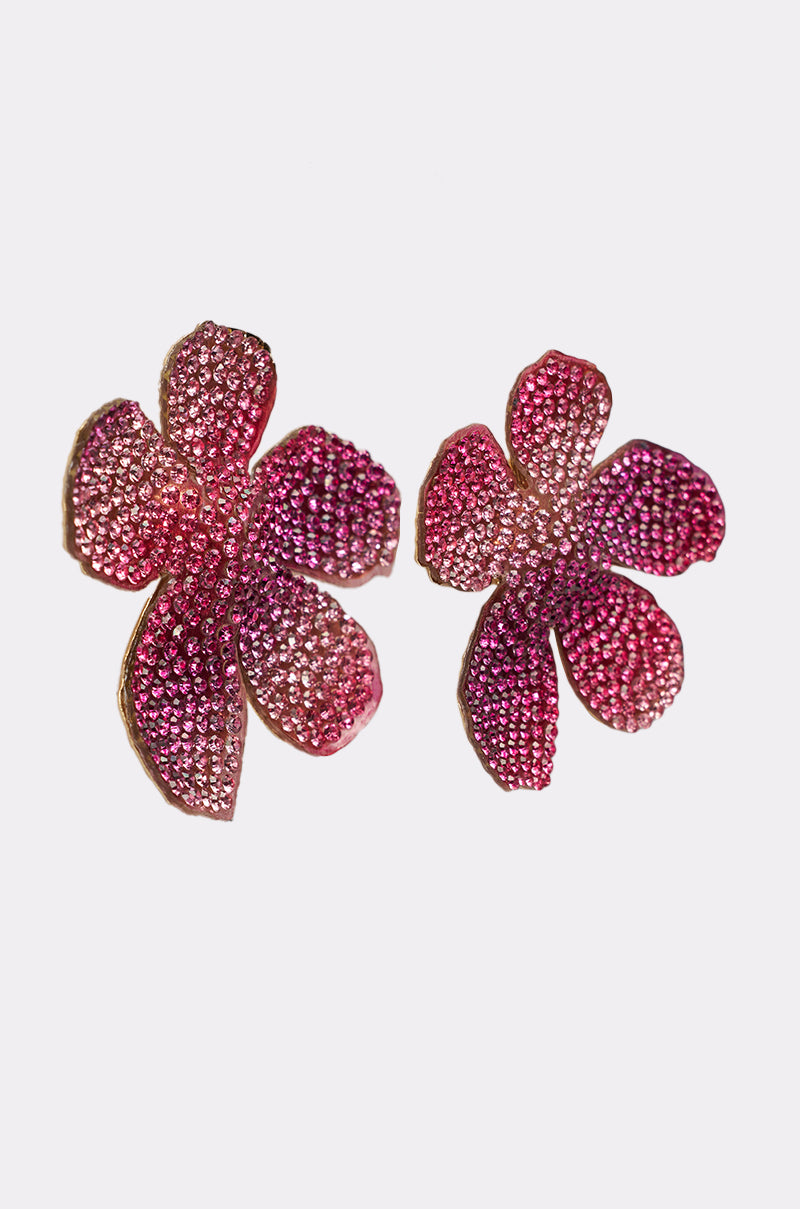 The WORTHY EARRING features pink floral studs adorned with small sparkling rhinestones, displayed on a plain white background. 3
