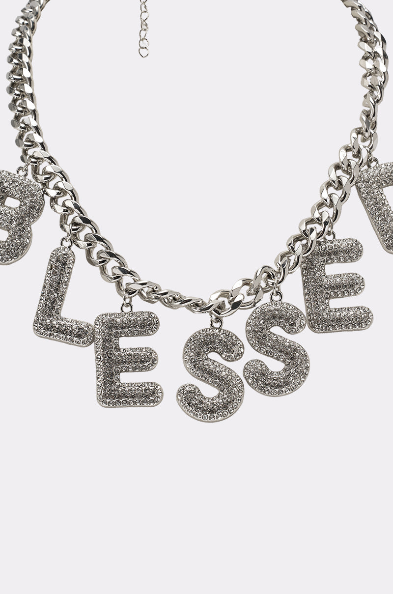 The BEYOND BLESSED NECKLACE showcases sparkling pavé letters, making this statement necklace a personal and stylish addition to any outfit. 4