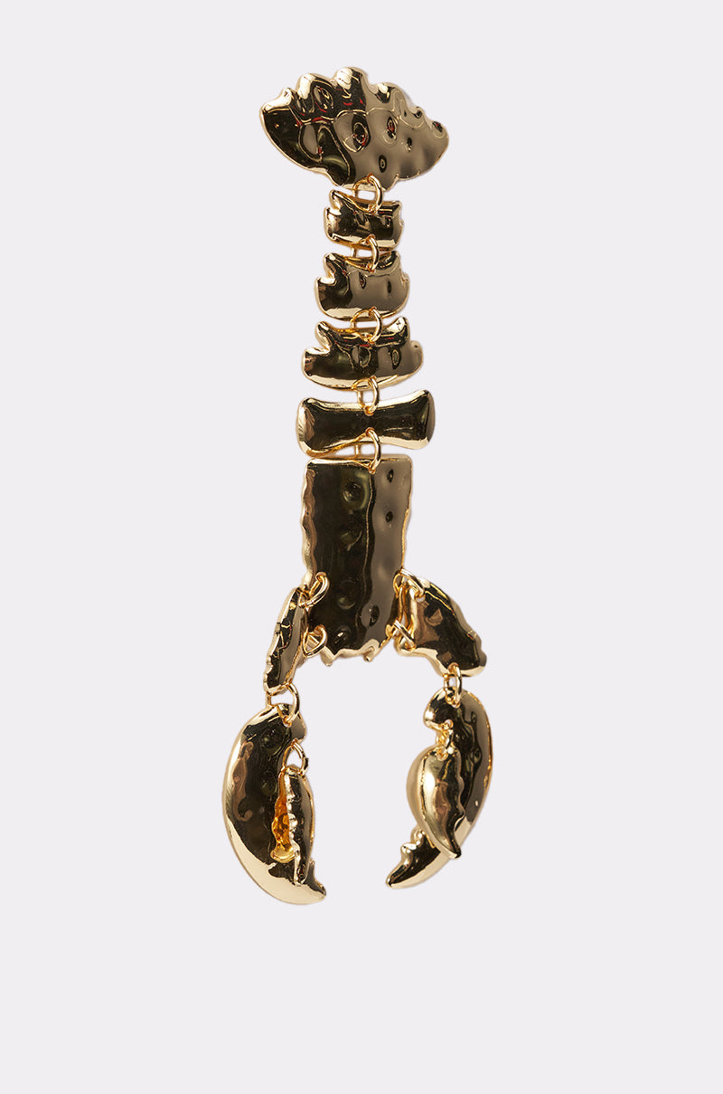 The BITE ME EARRING is a shiny gold lobster drop earring featuring articulated body segments and detailed claws, exuding ocean-chic style. Shown on a plain white background. 5