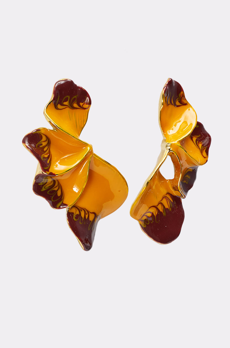 The FLOWER POWER EARRING is a lightweight statement pair shaped like abstract yellow and brown petals with a glossy finish, shown on a plain white background. 4