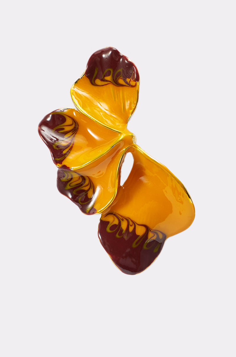 The FLOWER POWER EARRING features smooth, wavy forms in glossy yellow and deep burgundy, creating a sculptural, abstract look reminiscent of statement drop earrings against a plain light background. 5