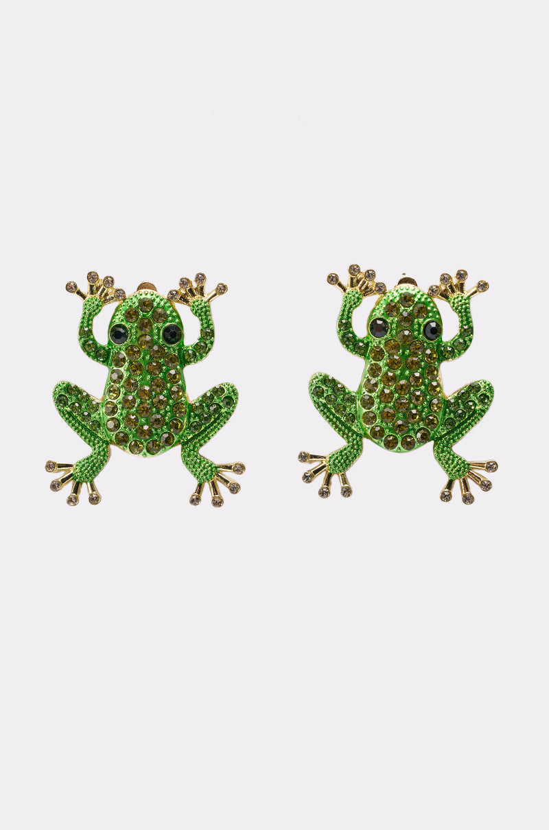 Two HERE I COME EARRING pieces, featuring green bodies, gold accents, and black eyes in a whimsical frog design, are displayed side by side on a white background. 1