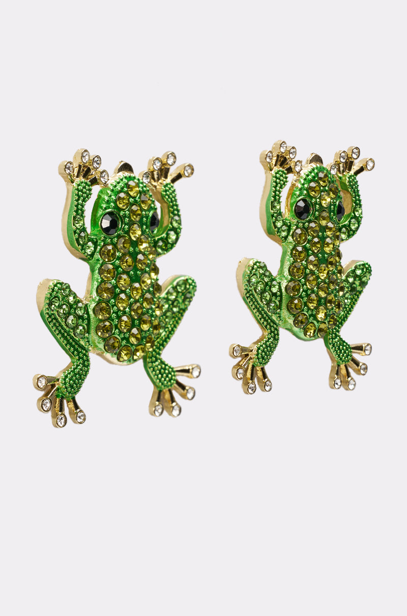 Two HERE I COME EARRING stud earrings, shaped like playful frogs in green and gold tones with sparkling green and clear rhinestones, are displayed on a plain white background. 4