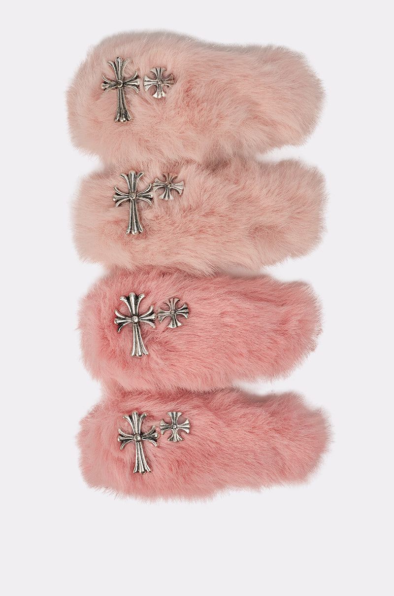 Four pairs of fluffy pink slippers, each with silver cross-shaped metal details, are arranged vertically against a plain light background—perfect for styling with the bold GET IT FUR HAIR CLIPS. 4