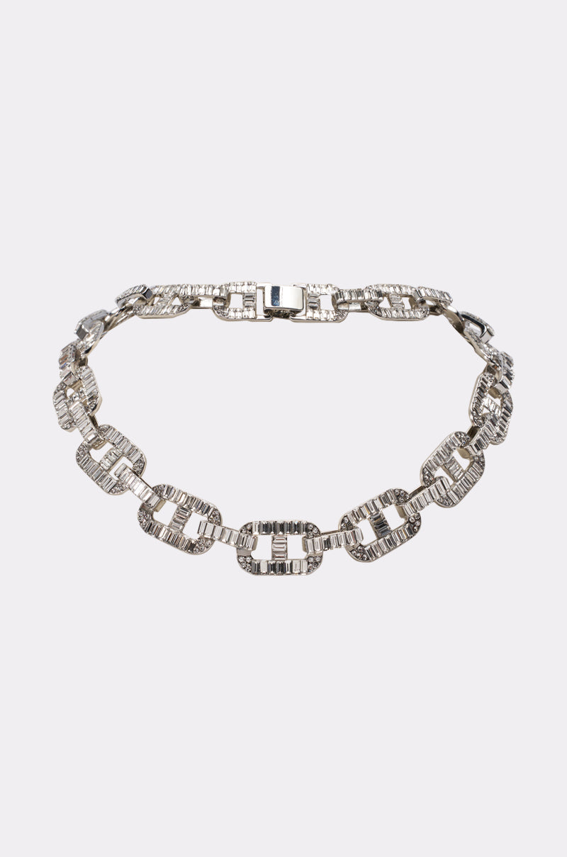 The LINK UP CHAIN is a silver-tone necklace featuring rectangular, interlocking links encrusted with sparkling rhinestones—perfect for a girls night out and showcased on a plain white background. 0