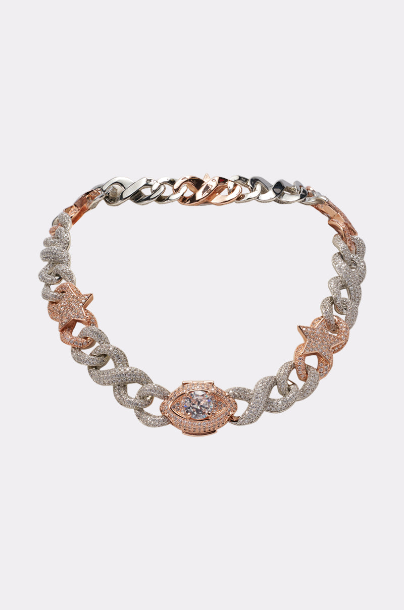 The BITE ME ICED CZ CHAIN is a gold and silver rhinestone chain necklace featuring a bold, eye-shaped pendant with sparkling CZ stones—perfect as a standout accessory for festivals. 0