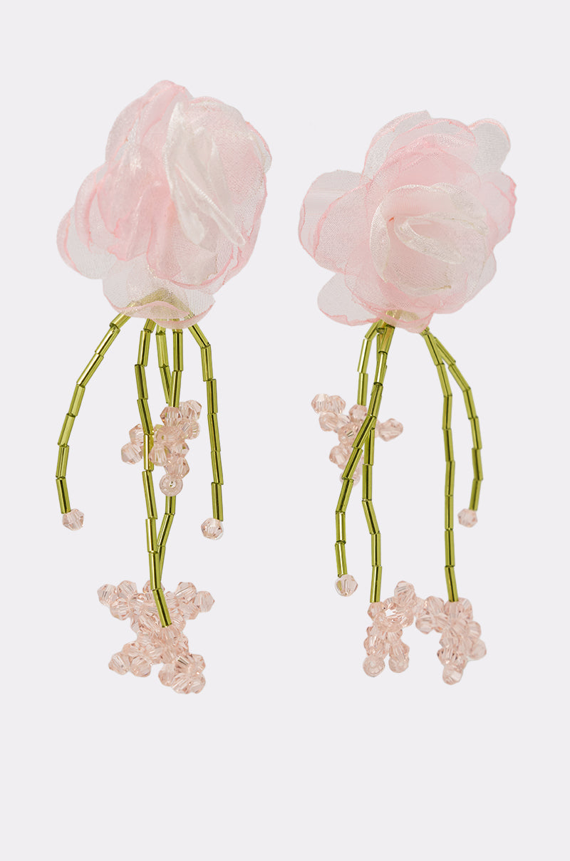 The IN THE GARDEN EARRING features soft pink organza flowers with green beaded stems and clusters of small pink bead blossoms, beautifully set against a white background. 2