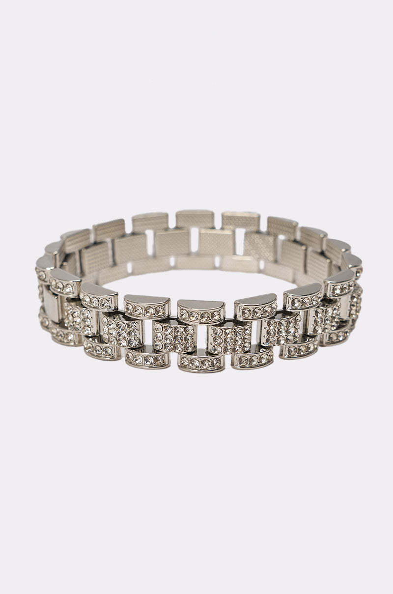 The BABY ICE ME OUT BRACELET features silver rectangular links adorned with sparkling rhinestones, displayed on a plain white background—perfect as a statement piece for any occasion. 0