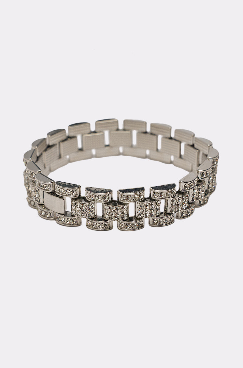 The BABY ICE ME OUT BRACELET is a chunky silver link bracelet adorned with rows of sparkling rhinestones, shown on a plain white background. 3