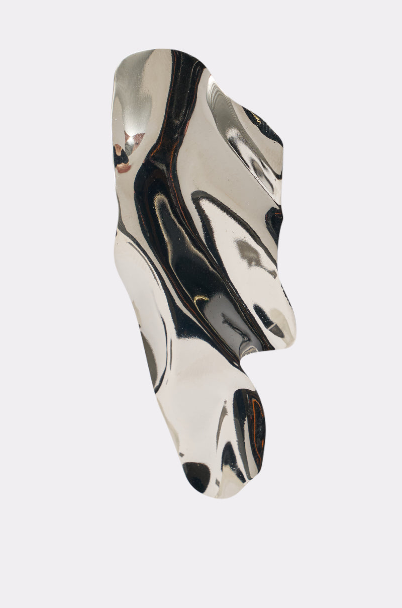 The CHROME GAL EARRING features an abstract, irregular, wavy silver design with a reflective polished surface on a plain white background, reminiscent of sculptural statement earrings. 3