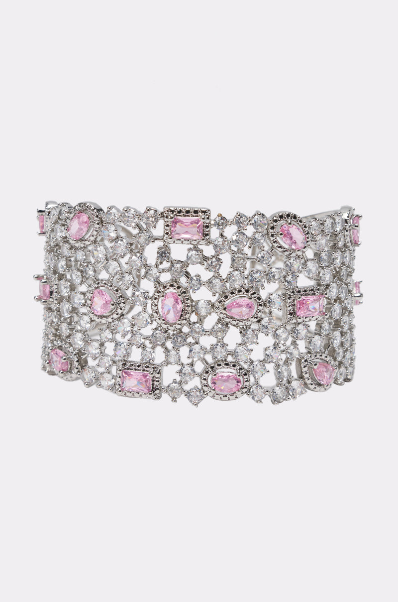 The KEKE CZ BRACELET CUFF features a wide open-lattice design, embellished with intricate silver and pink rhinestones, sparkling gemstones, and clear stones for an elegant, luxurious look.
