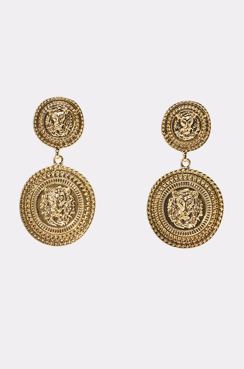The ABOUT THAT COIN EARRING features gold-tone medallions with intricate circular designs, a small round stud linked to a larger embossed pendant, and ornate detailing for a perfect boho-chic accessory.