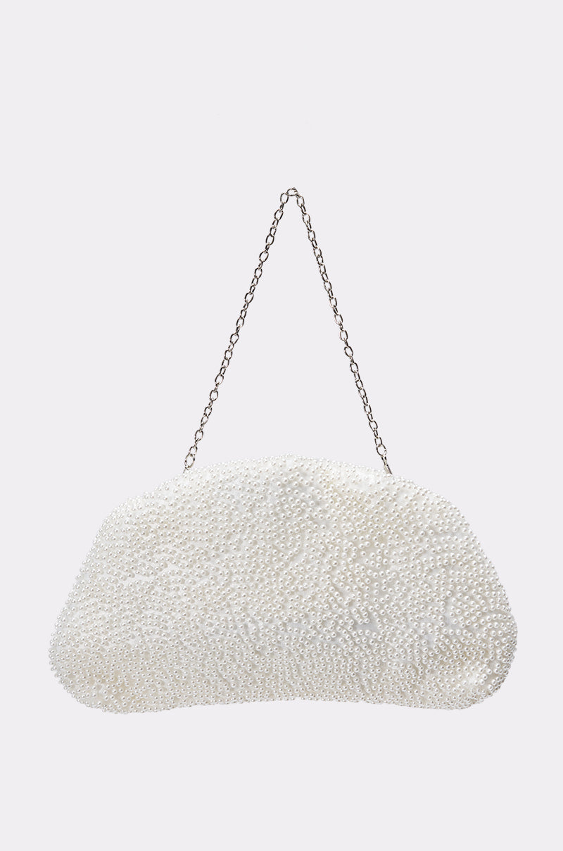The FEEL ME PEARL CLUTCH is a faux pearl handbag with a silver chain handle, covered in small pearls and set against a plain light gray background.