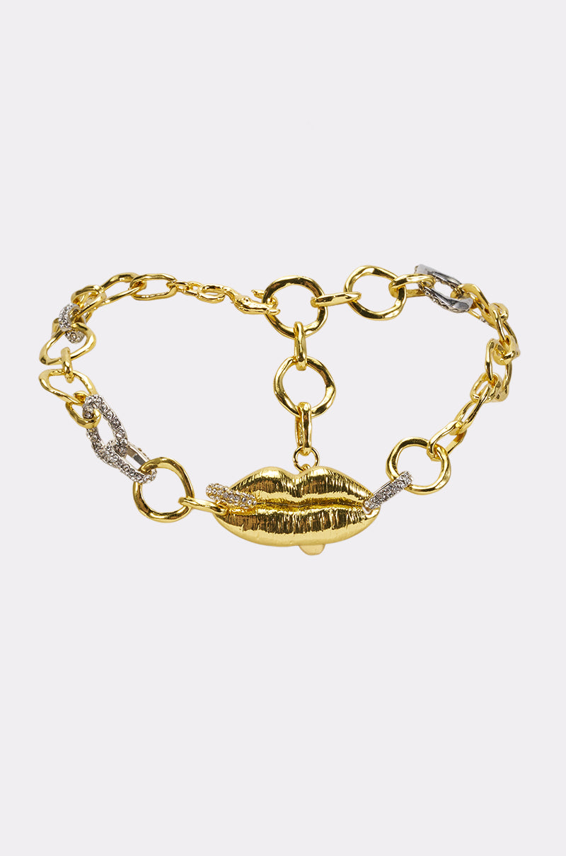 SWEET VENOM LIP NECKLACE featuring a bold gold chain design, highlighted by a central lips-shaped charm and select links accented with silver detailing, shown on a white background.