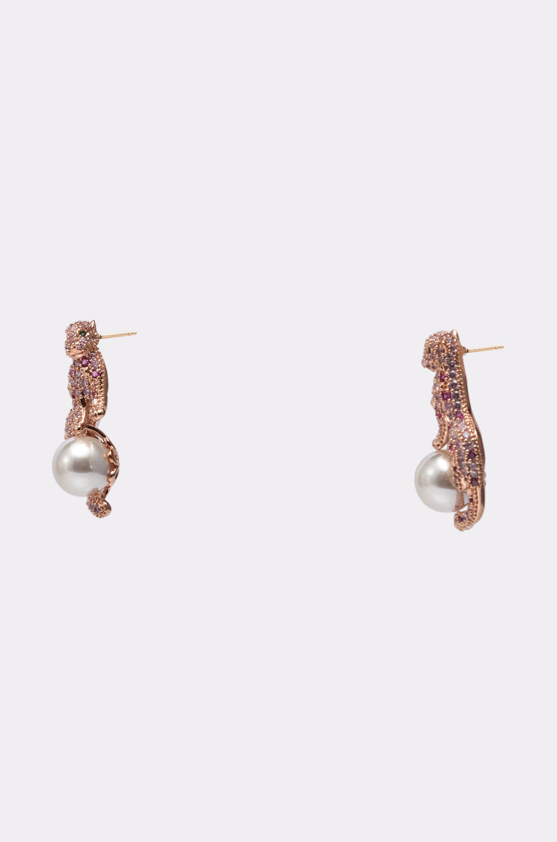 The LUXE PRIMETIME EARRING in gold and pink features textured hoops with dangling large round pearls, showcased against a plain light background. 3
