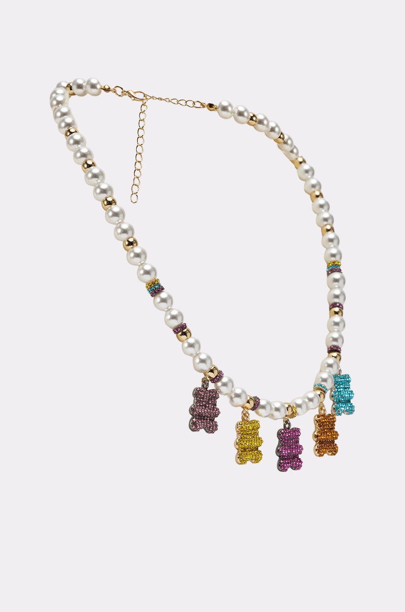 The LUXE BEAR CHARM NECKLACE features faux pearls, gold accents, and five colorful gummy bear pendants—purple, yellow, pink, gold, and blue—on an adjustable gold chain for a playful touch to any outfit. 3